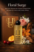 Hamper Floral Surge fragrance bottle with flowers and fruits on a dark background